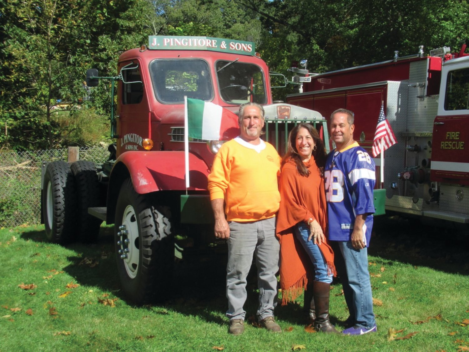 MIGHTY MEMORIAL: This is just one of the vintage vehicles — a 1952 Sterling White HB Tractor that the late Joseph Pingitore III owned and operated and will be on display throughout Sunday’s Ocean State Vintage Haulers 28th Annual Antique Truck Show in Johnston. Here he poses for a photo with sister Francine Pingitore and brother David David Pingitore, a long-time Johnston Firefighter who serves as Secretary-Treasurer of Local 1350, at a past event.